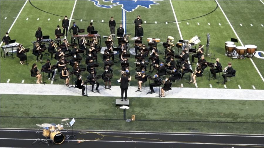 The+Rogers+High+School+Symphonic+Band+performed+their+spring+concert+in+2021+for+the+first+time+since+Spring+2019.+Both+concert+and+symphonic+bands+performed+in+Bentonville+at+the+ASBOA+Region+6+concert+assessment+after+performing+virtually+in+2020.
