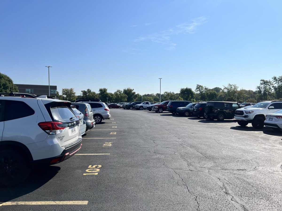 Students park their cars in assigned numbered spaces.