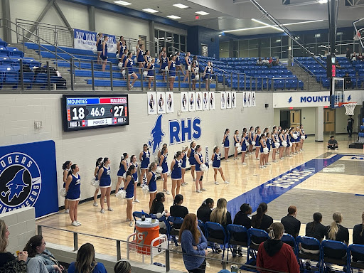 Rogers High School performs at a Lady Mountie basketball game.
