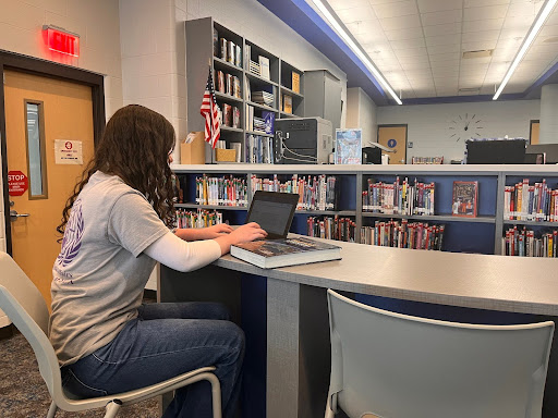 Student Adelyn Wright, 10, works on her daily assignments for her rigorous coursework in the RHS library.