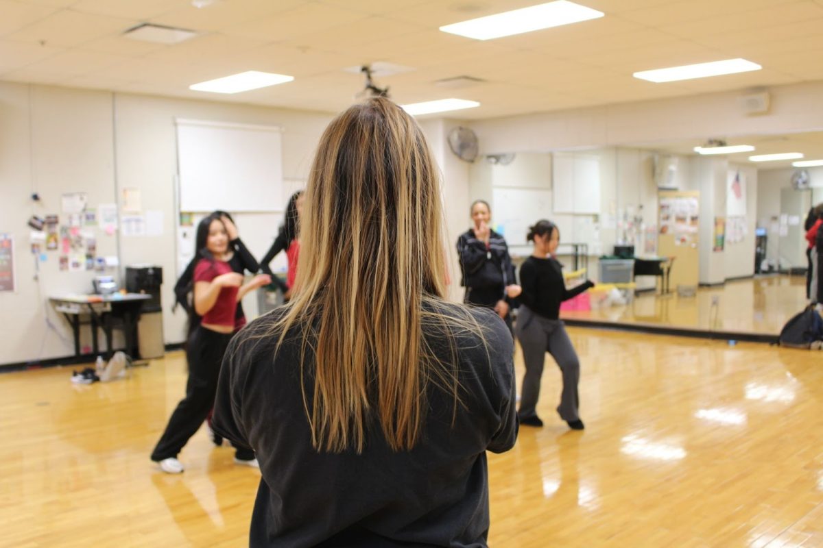 Elizabeth White, rehearsing winter recital dance with juniors and seniors.